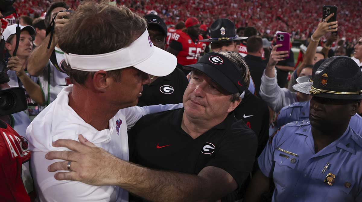 Georgia Bulldogs head coach Kirby Smart and Mississippi Rebels head coach Lane Kiffin meet on the field after the game at Sanford Stadium.