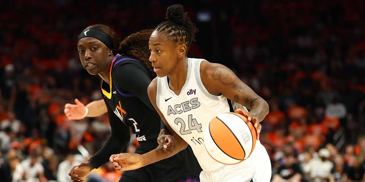 Las Vegas Aces guard Jewell Loyd (24) dribbles the ball past Phoenix Mercury guard Kahleah Copper (2) in the first half during game three of the 2025 WNBA Finals at PHX Arena.
