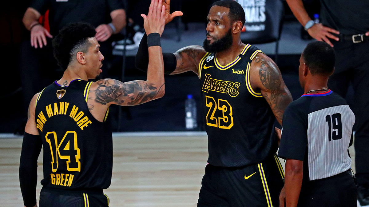 Los Angeles Lakers forward LeBron James (23) celebrates with guard Danny Green (14) after a play during the third quarter against the Miami Heat in game two of the 2020 NBA Finals at AdventHealth Arena.