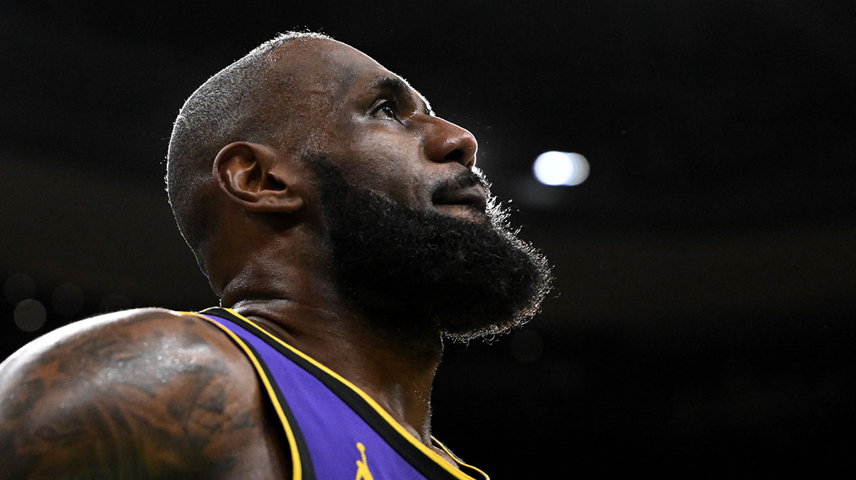 Los Angeles Lakers forward LeBron James (23) looks into the crowd during a timeout in the fourth quarter of a game against the Boston Celtics at the TD Garden.
