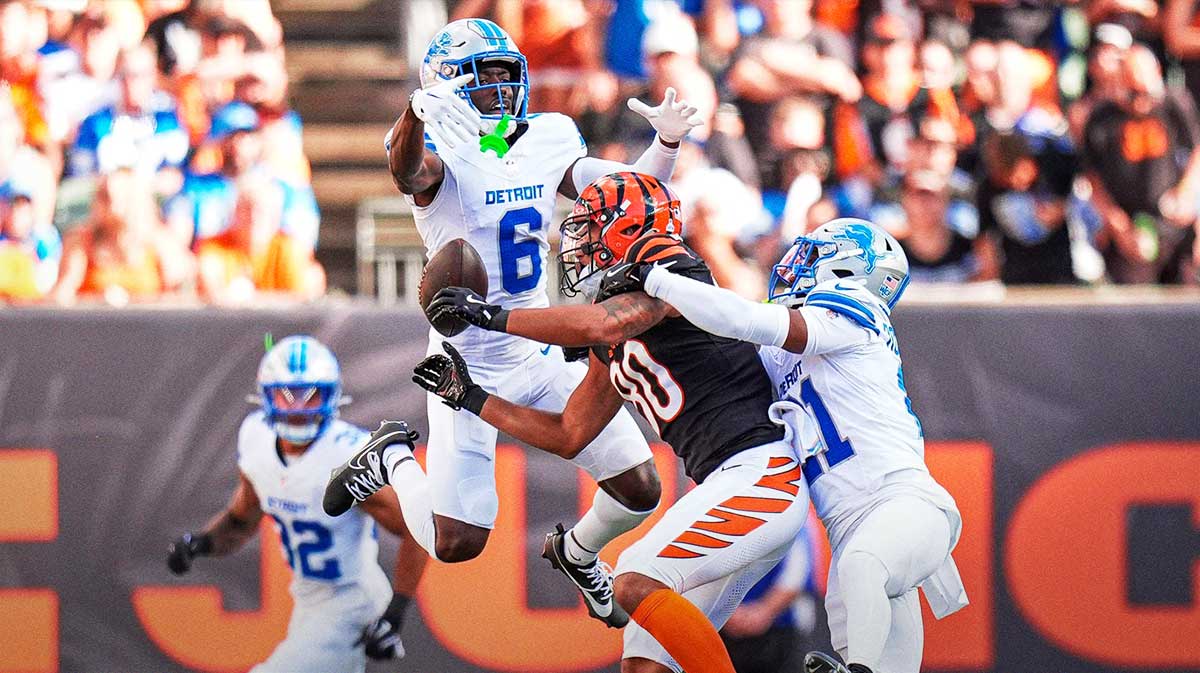 Detroit Lions cornerbacks Terrion Arnold (6) and Amik Robertson (21) break up a pass intended for Cincinnati Bengals wide receiver Andrei Iosivas during the first half at Paycor Stadium in Cincinnati on Sunday, Oct. 5, 2025.
