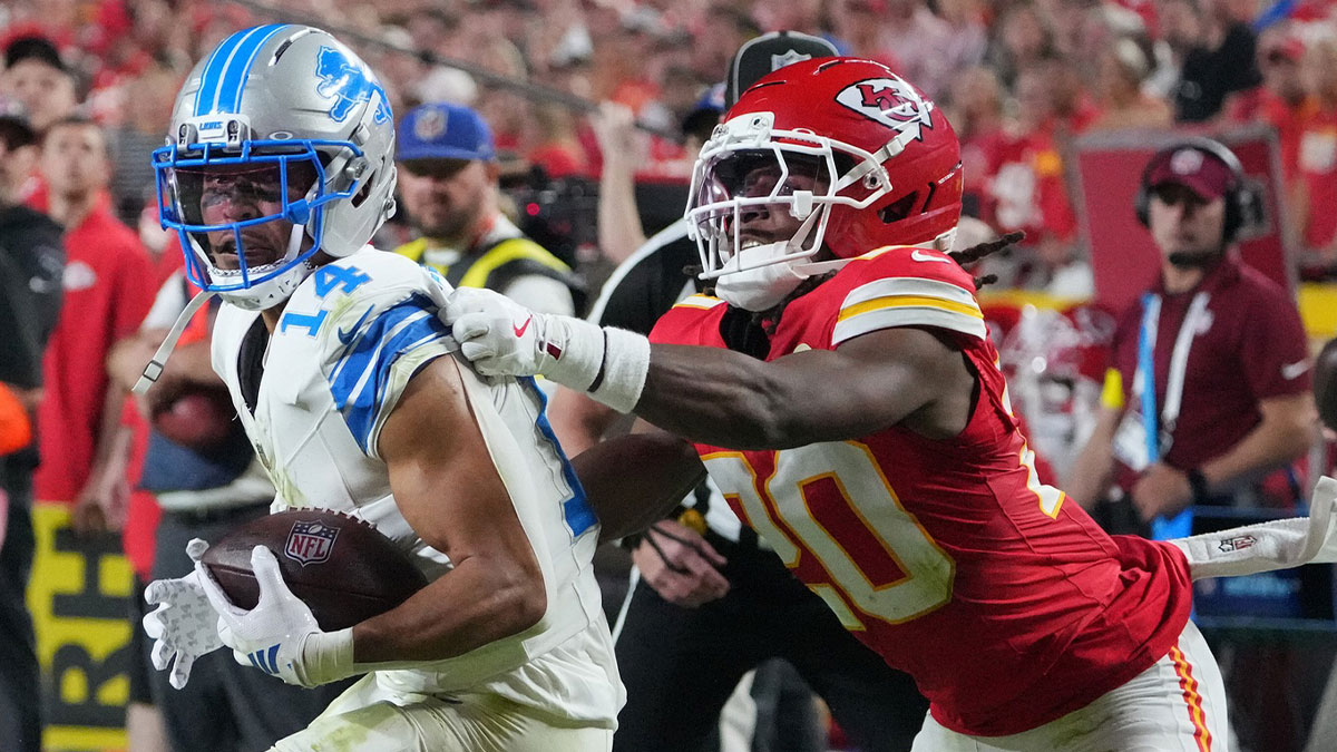 Detroit Lions wide receiver Amon-Ra St. Brown (14) makes a catch against Kansas City Chiefs cornerback Nohl Williams (20) during the second half at GEHA Field at Arrowhead Stadium.