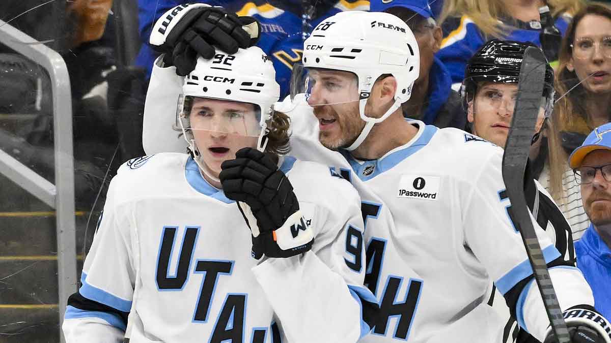 Utah Mammoth center Logan Cooley (92) is congratulated by defenseman Ian Cole (28) after scoring against the St. Louis Blues during the first period at Enterprise Center.