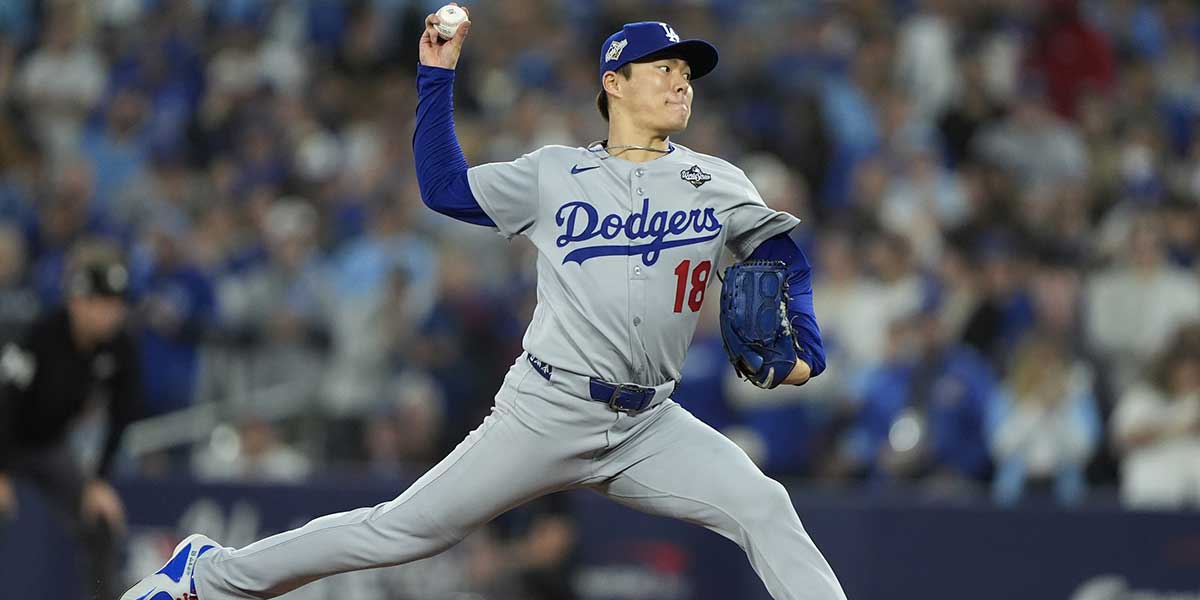 Los Angeles Dodgers pitcher Yoshinobu Yamamoto (18) pitches against the Toronto Blue Jays in the ninth inning during game two of the 2025 MLB World Series at Rogers Centre.