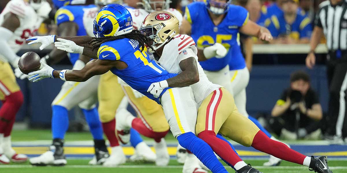 Los Angeles Rams wide receiver Davante Adams (17) makes a catch against San Francisco 49ers cornerback Renardo Green (0) during the first half at SoFi Stadium.