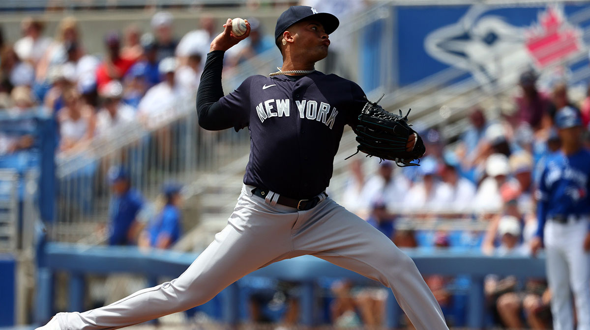 New York Yankees starting pitcher Luis Gil (81) throws a pitch during the first inning during against the Toronto Blue Jays spring training at TD Ballpark. 