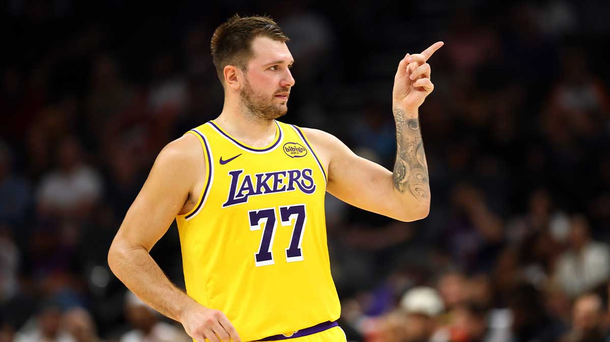 Los Angeles Lakers guard Luka Doncic (77) reacts against the Phoenix Suns during an NBA preseason game at Mortgage Matchup Center.