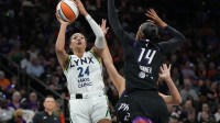 Minnesota Lynx forward Napheesa Collier (24) shoots over Phoenix Mercury forward DeWanna Bonner (14) during game three of the second round for the 2025 WNBA Playoffs at PHX Arena.