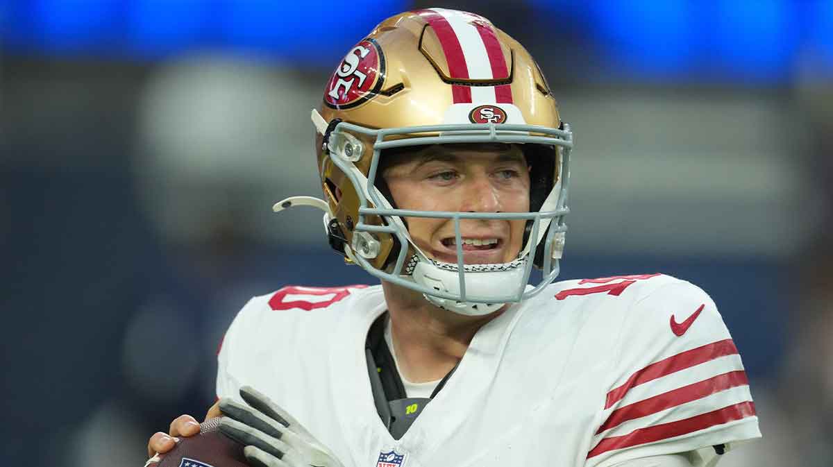 San Francisco 49ers quarterback Mac Jones (10) drops back to pass against the Los Angeles Rams during the first half at SoFi Stadium.