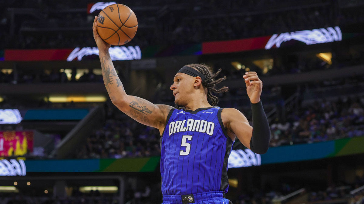 Orlando Magic forward Paolo Banchero (5) grabs the rebound against the Boston Celtics during the second half of game three of first round for the 2024 NBA Playoffs at Kia Center.