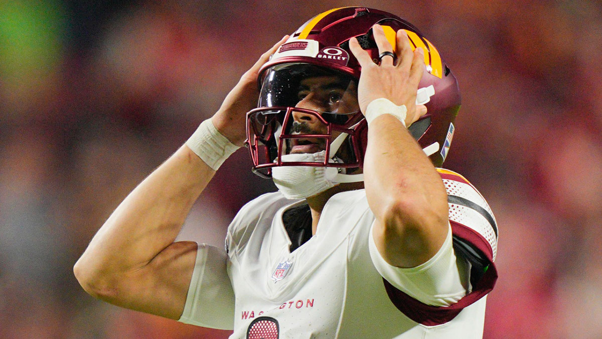 Washington Commanders quarterback Marcus Mariota (8) reacts during the second quarter of the game against the Kansas City Chiefs at GEHA Field at Arrowhead Stadium.