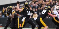 Iowa Hawkeyes quarterback Mark Gronowski (11) throws a pass during the first quarter against the Minnesota Golden Gophers at Kinnick Stadium.