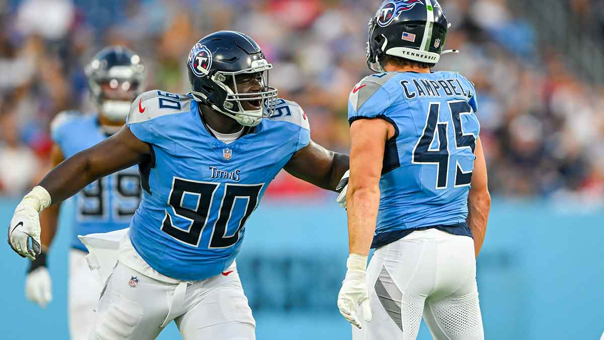 Tennessee Titans linebacker Chance Campbell (45) and defensive tackle Marlon Davidson (90) celebrate the sack against the San Francisco 49ers during the first half during the first half at Nissan Stadium.