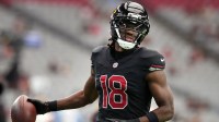 Arizona Cardinals receiver Marvin Harrison Jr. (18) warms up before their game against the Tennessee Titans at State Farm Stadium.
