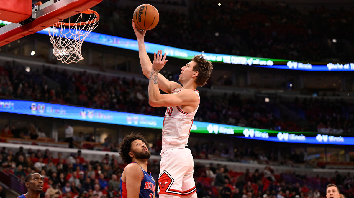 Chicago Bulls forward Matas Buzelis (14) shoots over Detroit Pistons guard Cade Cunningham (2) during the first half at United Center.