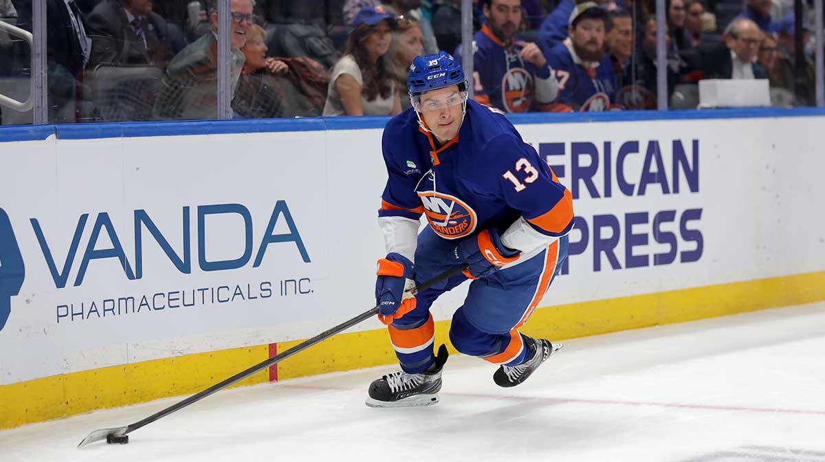 New York Islanders center Mathew Barzal (13) skates with the puck against the San Jose Sharks during the second period at UBS Arena.