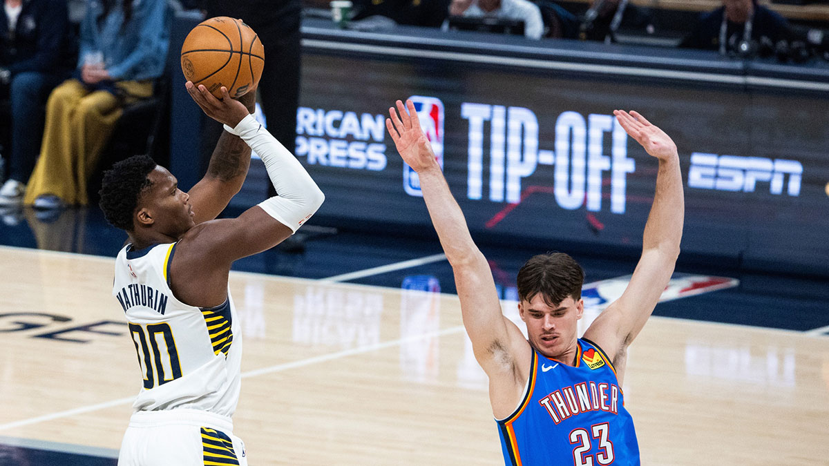 Indiana Pacers guard Bennedict Mathurin (00) shoots the ball while Oklahoma City Thunder forward Brooks Barnhizer (23) defends in the first half at Gainbridge Fieldhouse.