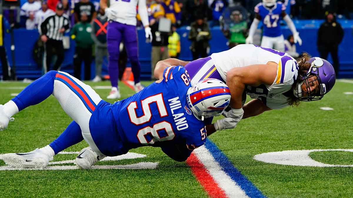 Buffalo Bills linebacker Matt Milano (58) tackles Minnesota Vikings tight end T.J. Hockenson (87) during second half at Highmark Stadium. 