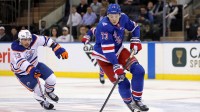 New York Rangers center Matt Rempe (73) skates with the puck against Edmonton Oilers left wing Isaac Howard (53) during the third period at Madison Square Garden