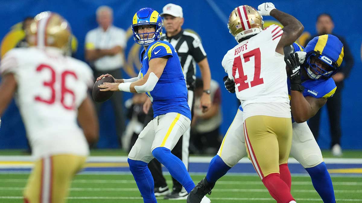 Los Angeles Rams quarterback Matthew Stafford (9) drops back to pass against the San Francisco 49ers during the first half at SoFi Stadium.