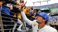 Los Angeles Rams quarterback Matthew Stafford (9) greets his family after the game against the Baltimore Ravens at M&T Bank Stadium.