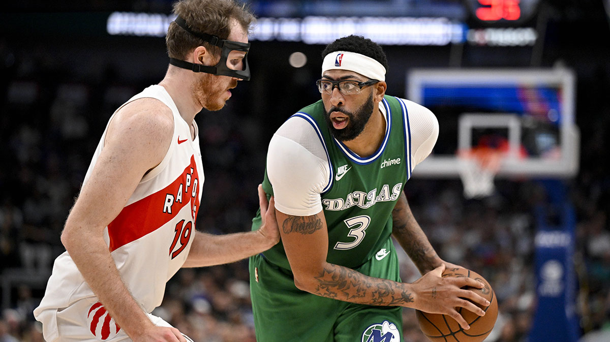 Dallas Mavericks forward Anthony Davis (3) looks to move the ball past Toronto Raptors center Jakob Poeltl (19) during the second half at the American Airlines Center.