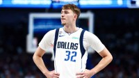 Dallas Mavericks forward Cooper Flagg (32) reacts against the San Antonio Spurs during the second half at American Airlines Center.