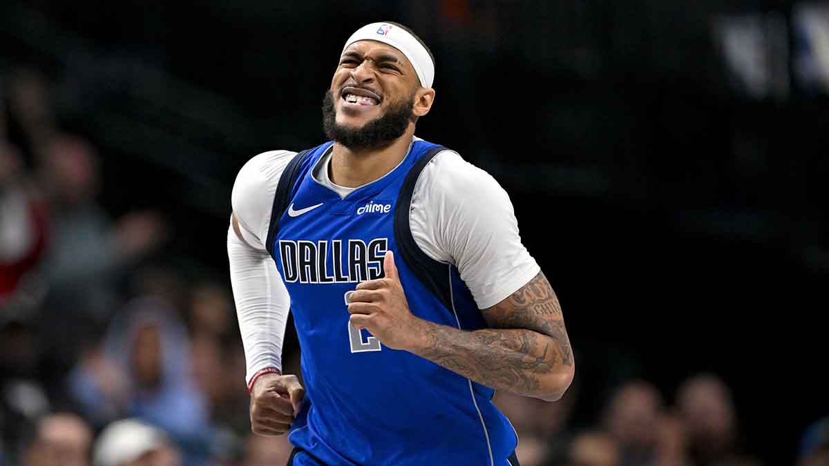 Dallas Mavericks center Daniel Gafford (21) grimaces as he runs back up the court during the second half against the Brooklyn Nets at the American Airlines Center.