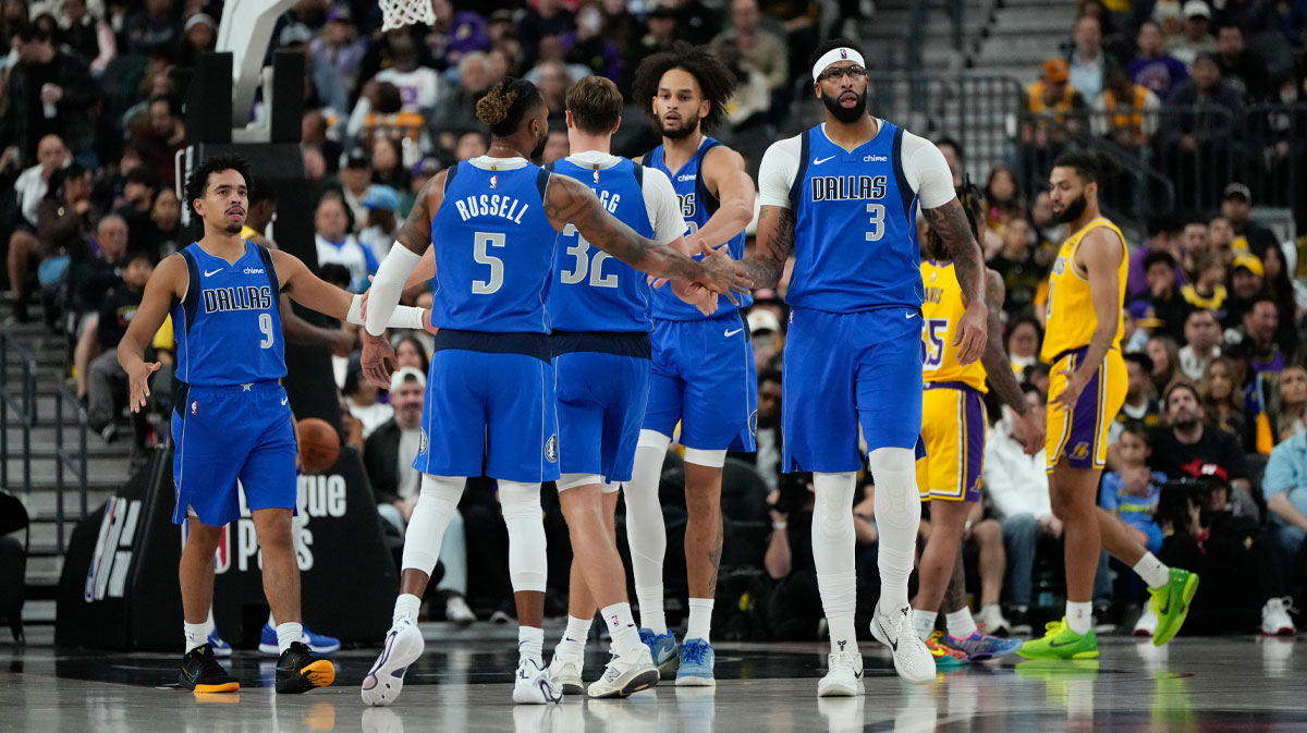 Dallas Mavericks forward Anthony Davis (3) celebrates with teammates after scoring against the Los Angeles Lakers during the second half at T-Mobile Arena.