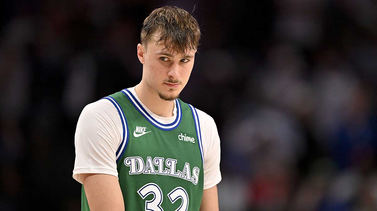 Mavericks forward Cooper Flagg (32) looks on during the second half against the Oklahoma City Thunder at the American Airlines Center with Thunder head coach Mark Daigneault in the background