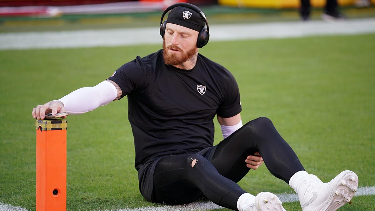 Las Vegas Raiders defensive end Maxx Crosby (98) stretches during warmups prior to the game against the Kansas City Chiefs at GEHA Field at Arrowhead Stadium.