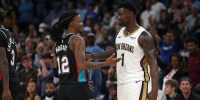 Memphis Grizzlies guard Ja Morant (12) and New Orleans Pelicans forward Zion Williamson (1) talk during the fourth quarter at FedExForum.