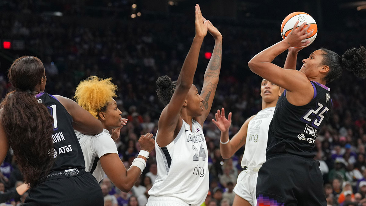 Phoenix Mercury forward Alyssa Thomas (25) shoots against Las Vegas Aces guard Jewell Loyd (24) during the second half of game four of the 2025 WNBA Finals at Mortgage Matchup Center.