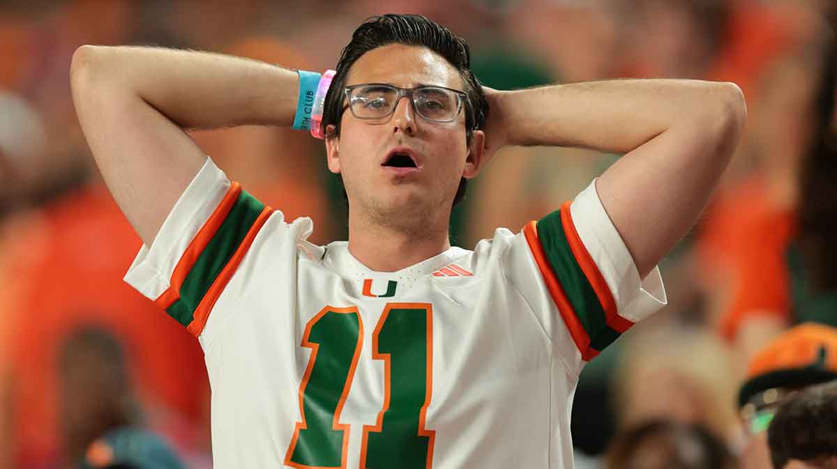 A Miami Hurricanes fans reacts from the stands against the Louisville Cardinals during the third quarter at Hard Rock Stadium.