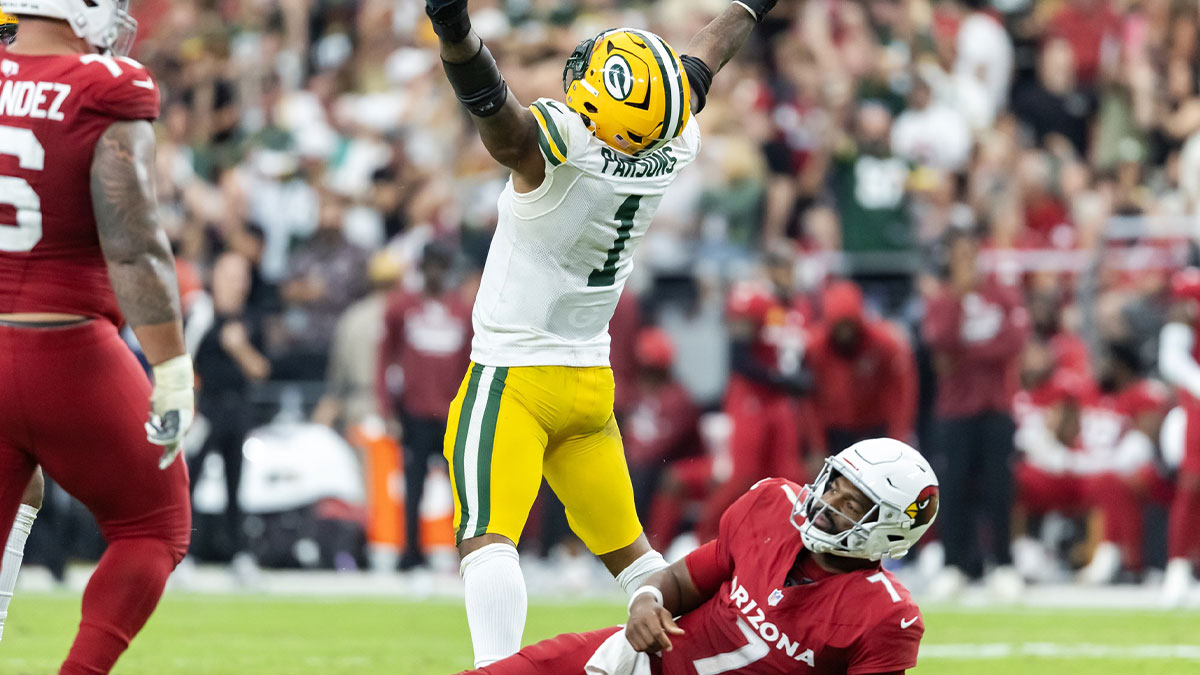 Arizona Cardinals quarterback Jacoby Brissett (7) is sacked by Green Bay Packers defensive lineman Micah Parsons (1) in the second half at State Farm Stadium.