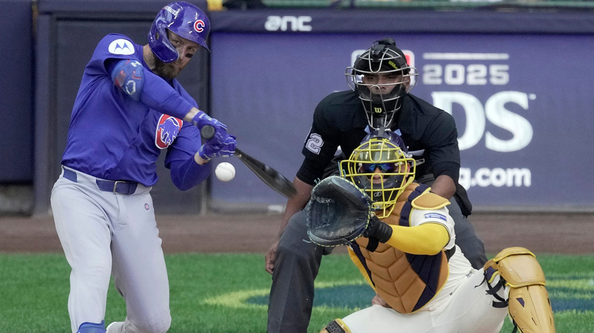 Chicago Cubs first baseman Michael Busch (29) hits a solo home run off Milwaukee Brewers pitcher Freddy Peralta during the first inning of their National League Division Series game.