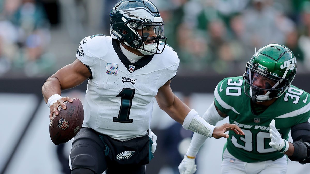 Philadelphia Eagles quarterback Jalen Hurts (1) drops back to pass against New York Jets cornerback Michael Carter II (30) during the first quarter at MetLife Stadium.