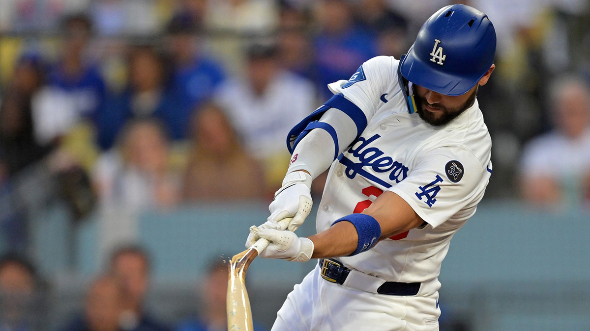 Los Angeles Dodgers outfielder Michael Conforto (23) breaks a bat Minnesota Twins in the second inning at Dodger Stadium.