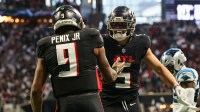 Atlanta Falcons quarterback Michael Penix Jr. (9) celebrates with wide receiver Drake London (5) after a touchdown run against the Carolina Panthers in the second quarter at Mercedes-Benz Stadium.