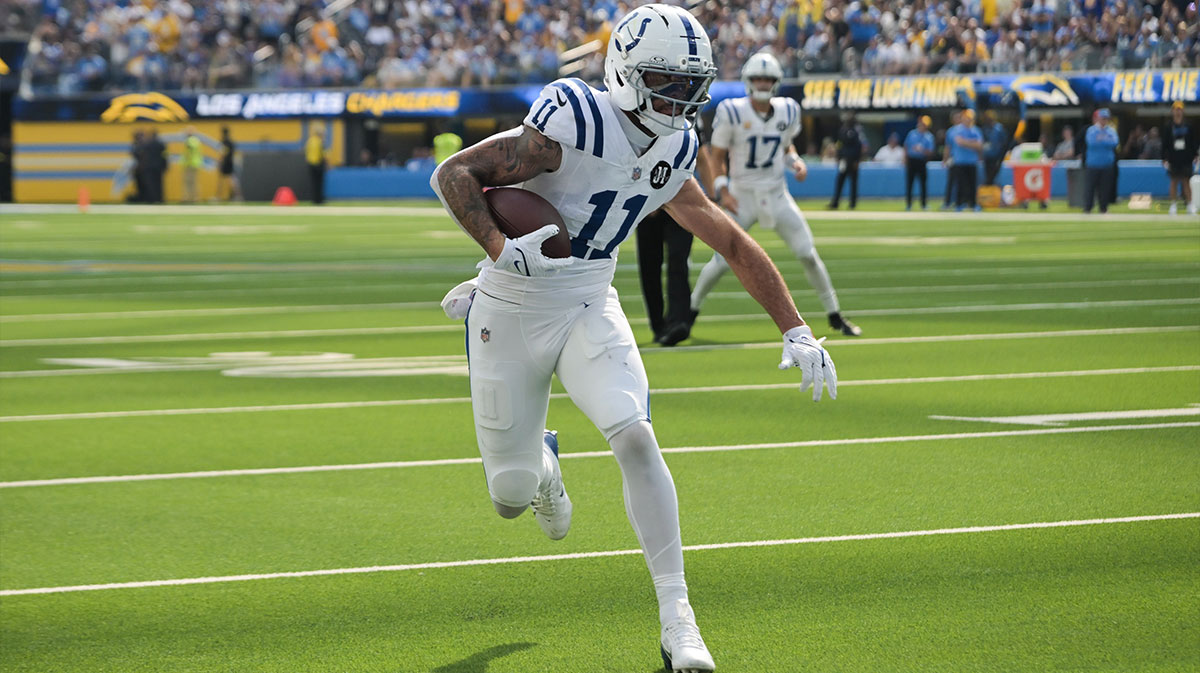 Indianapolis Colts wide receiver Michael Pittman Jr. (11) runs the ball for a touchdown in the first quarter against the Los Angeles Chargers at SoFi Stadium.