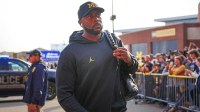 Michigan head coach Sherrone Moore arrives ahead of the Washington game at Michigan Stadium