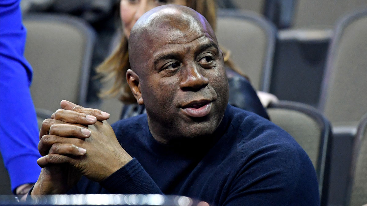 NBA former player Magic Johnson watches during the first half between the Clemson Tigers and the Kansas Jayhawks in the semifinals of the Midwest regional of the 2018 NCAA Tournament at CenturyLink Center.