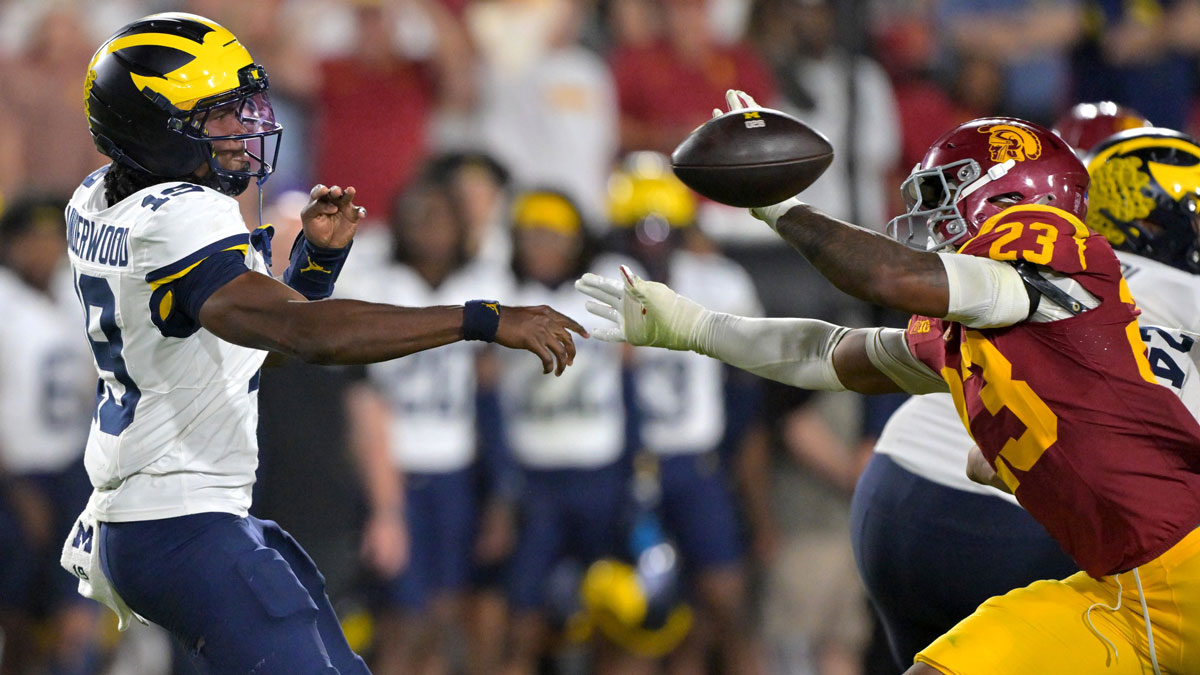 USC Trojans cornerback Trestin Castro (37) deflects a pass by Michigan Wolverines quarterback Bryce Underwood (19) in the second half at United Airlines Field at the Los Angeles Memorial Coliseum.