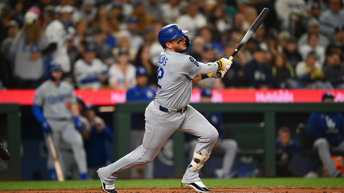 Los Angeles Dodgers second baseman Miguel Rojas (72) hits a double against the Seattle Mariners during the fifth inning at T-Mobile Park.