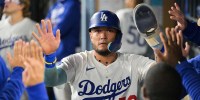 Los Angeles Dodgers second baseman Miguel Rojas (72) celebrates after scoring a run during the seventh inning against the Cincinnati Reds during game one of the Wildcard round for the 2025 MLB playoffs at Dodger Stadium.
