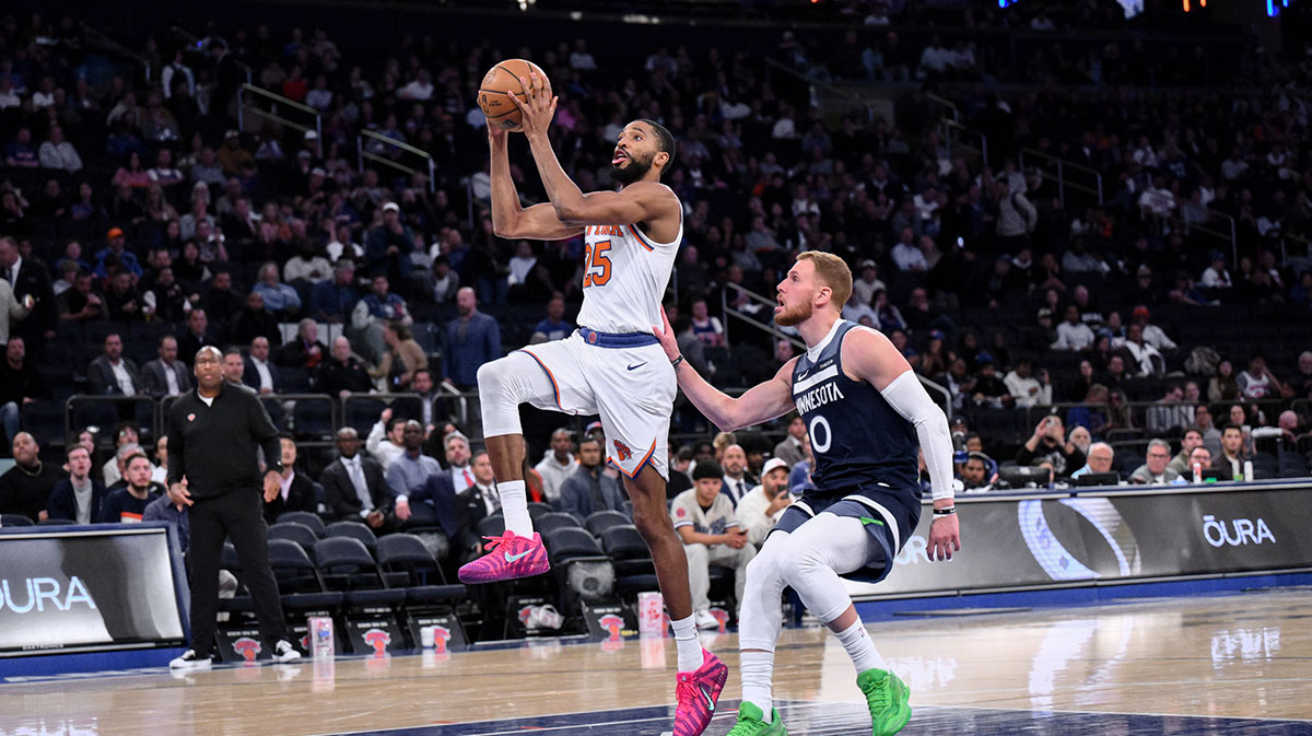 New York Knicks guard/forward Mikal Bridges (25) drives past Minnesota Timberwolves guard Donte Divincenzo during the second half at Madison Square Garden.