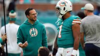 Miami Dolphins head coach Mike McDaniel talks with quarterback Tua Tagovailoa (1) prior to the game against the Dallas Cowboys at Hard Rock Stadium.