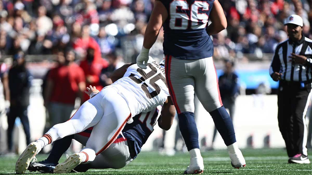 Cleveland Browns defensive end Myles Garrett (95) sacks New England Patriots quarterback Drake Maye (10) during the first quarter at Gillette Stadium.