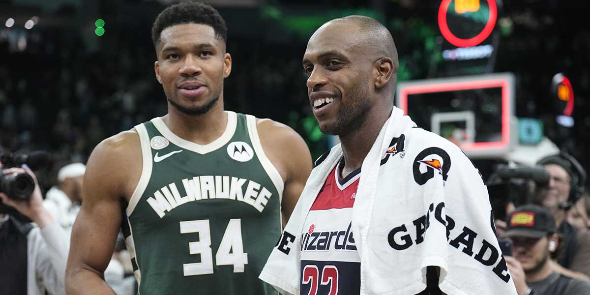 Milwaukee Bucks forward Giannis Antetokounmpo (34) and Washington Wizards forward Khris Middleton (22) former teammates talk to each other after their game at Fiserv Forum.