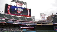 The scoreboard displays the Opening Day logo for Minnesota Twins Home Opener before a game against the Houston Astros at Target Field.